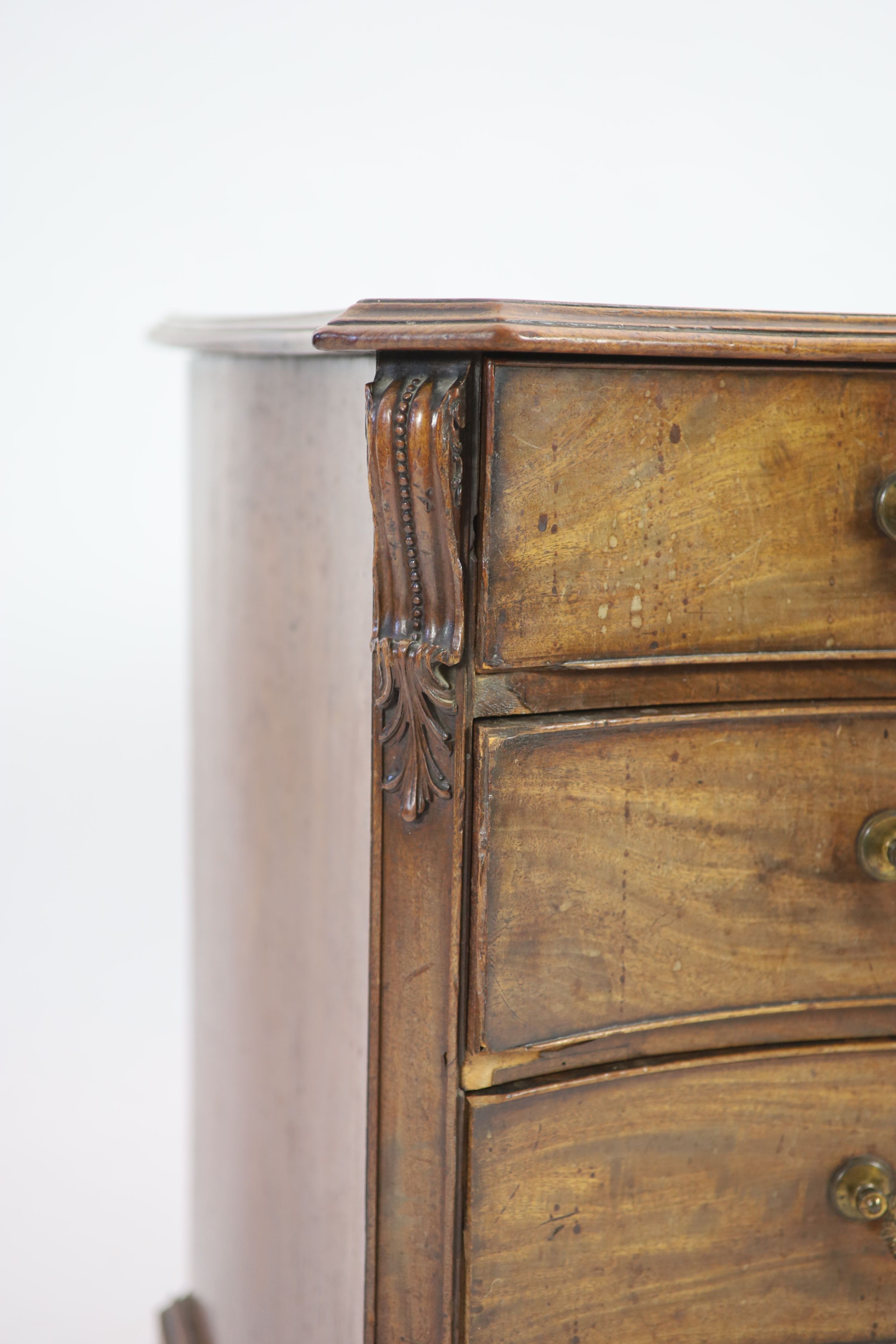 A George III Chippendale style mahogany serpentine commode W 112cm D 62cm H 83cm